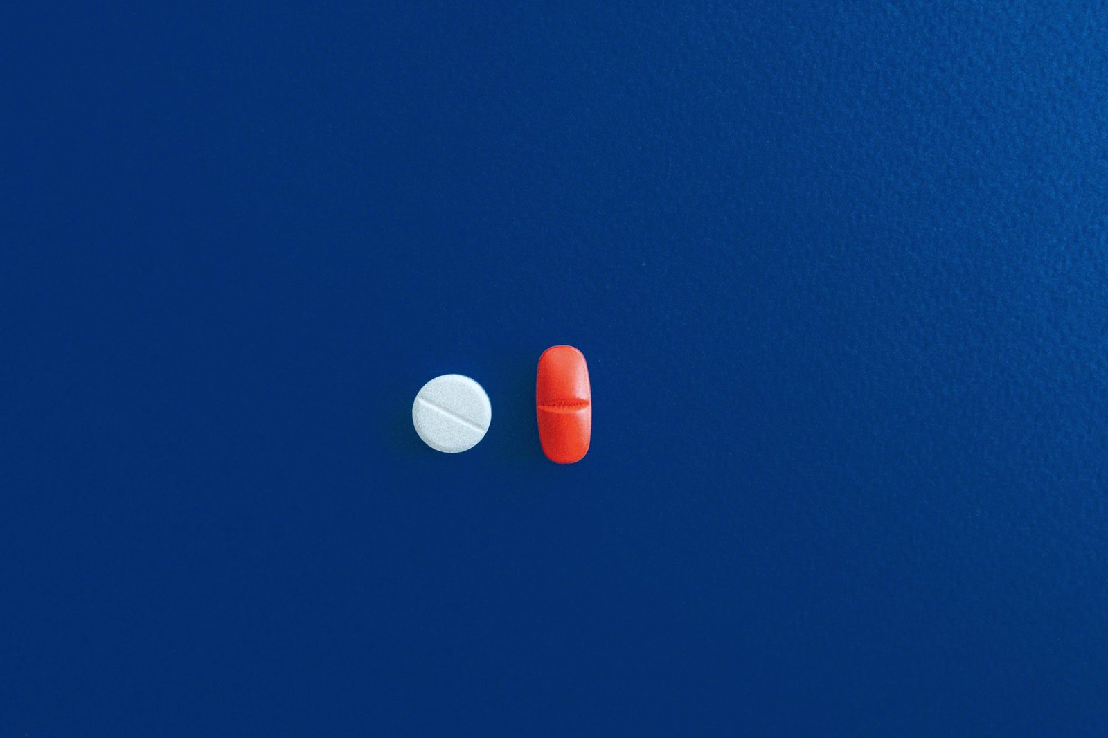 Two different tablets side by side on a blue background
